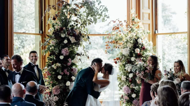 Event Planner: Coleen McKay. Wedding in Scotland castle, floral wedding arch, winter wedding aisle.