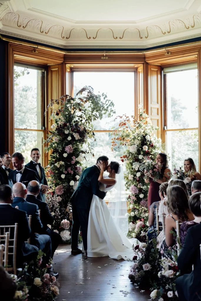 Event Planner: Coleen McKay. Wedding in Scotland castle, floral wedding arch, winter wedding aisle.