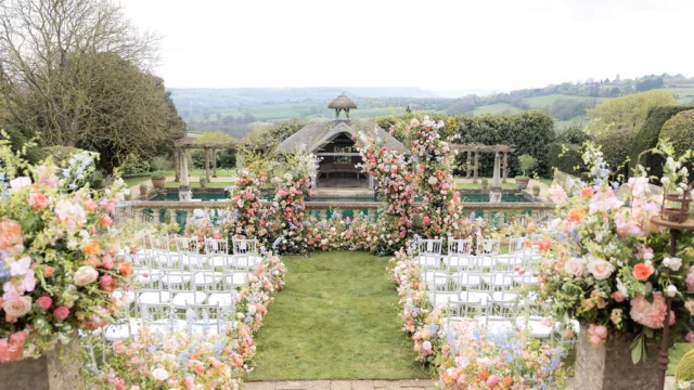 Event Planner: Hannah Hope Events. Fairytale wedding aisle, soft pastel wedding colours, pastel floral arrangement, summer wedding countryside.