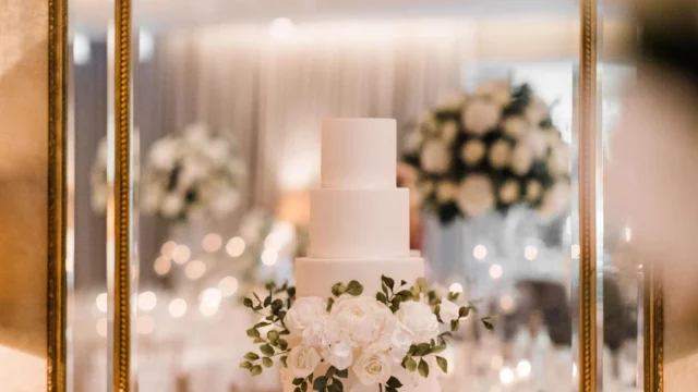 Cake Designer: Poppy Pickering Cake Design. Modern 6 tier wedding white cake, floral decor.